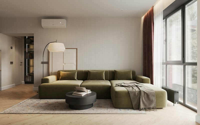 Wohnzimmer mit grünem Sofa